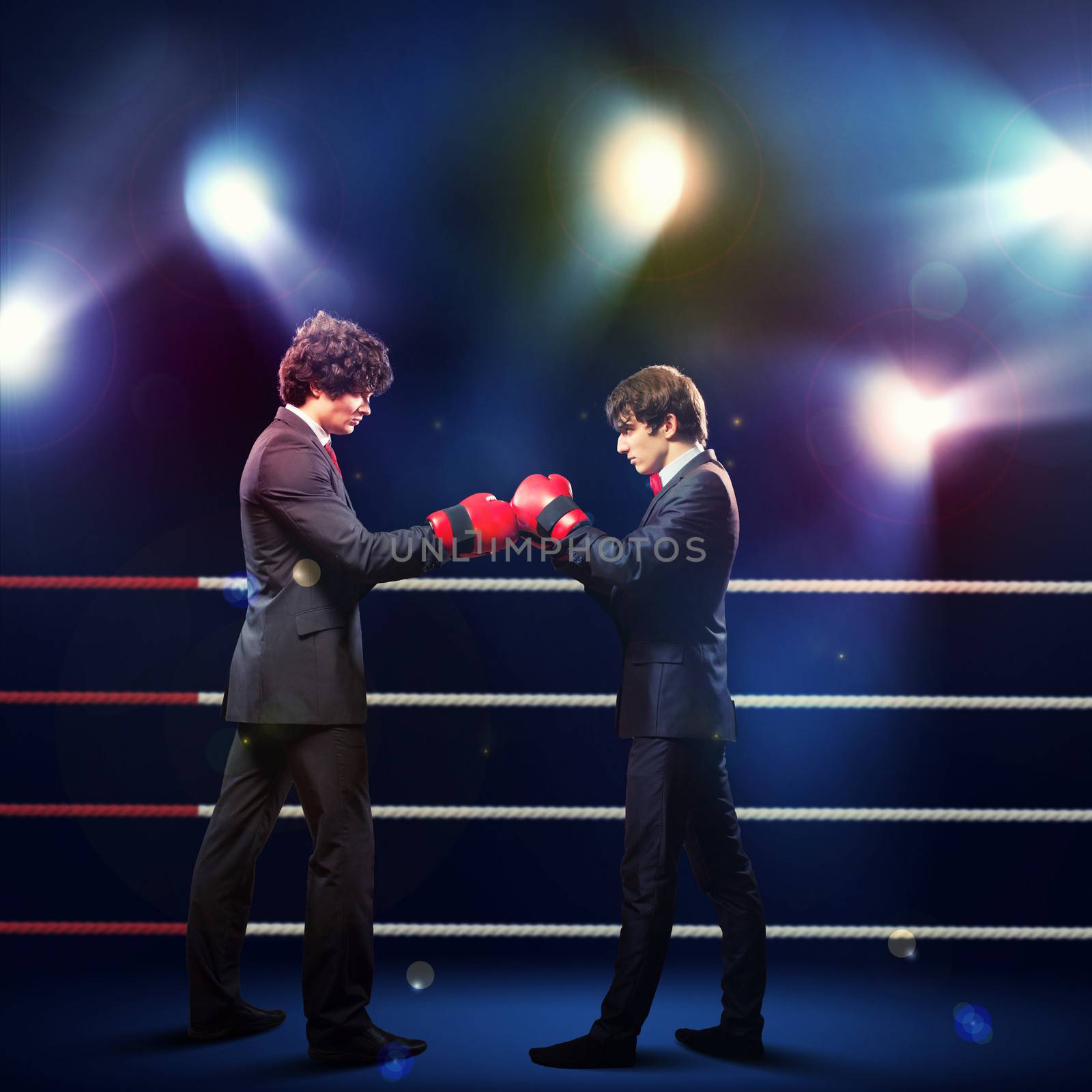 Two young businessman boxing by sergey_nivens