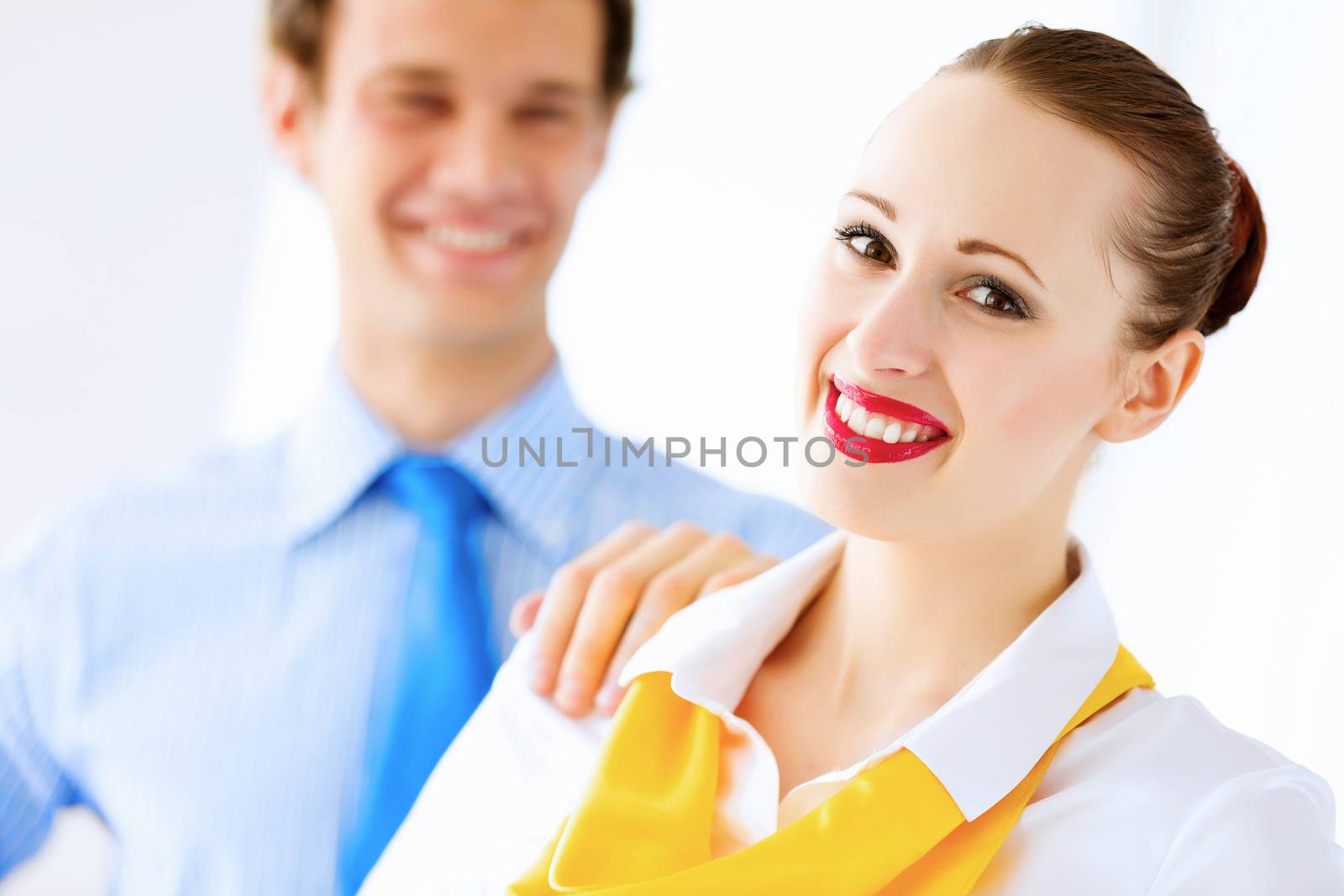 Image of businessman and businesswoman smiling joyfully