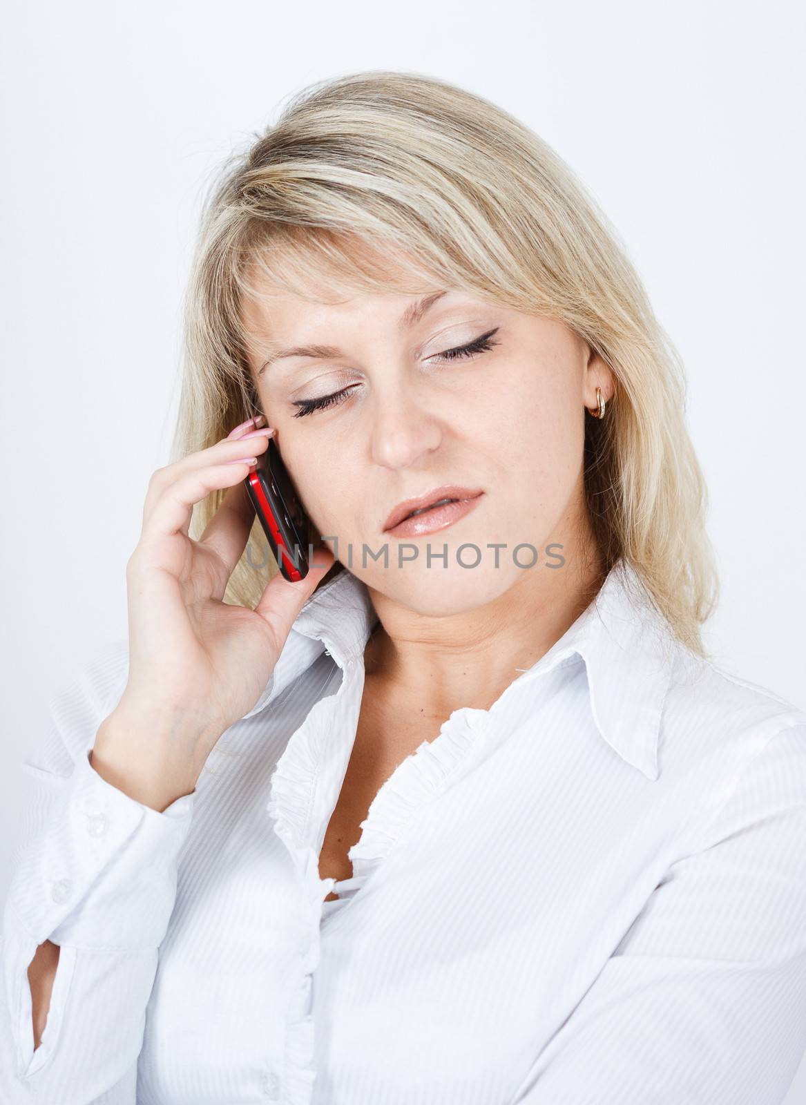 The girl fallen asleep while talking on a cell phone