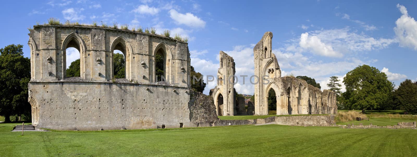 Panoramic view of the historic ruins of Glastonbury Abbey in Somerset, England.