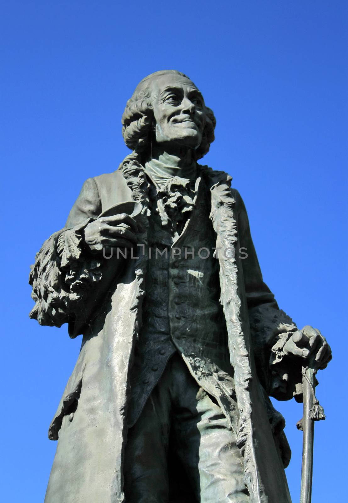 Ancient statue of the famous french philosopher Voltaire (1694-1778) at Ferney-Voltaire, France