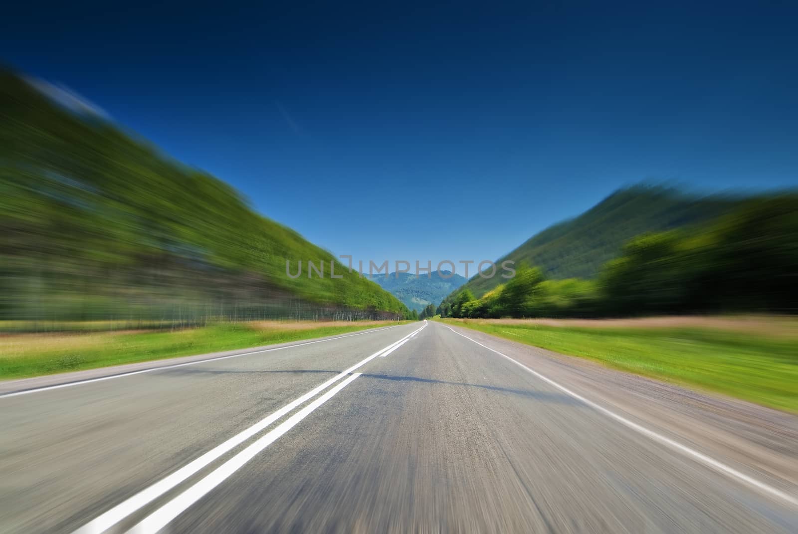 The direct road leading into the mountains.