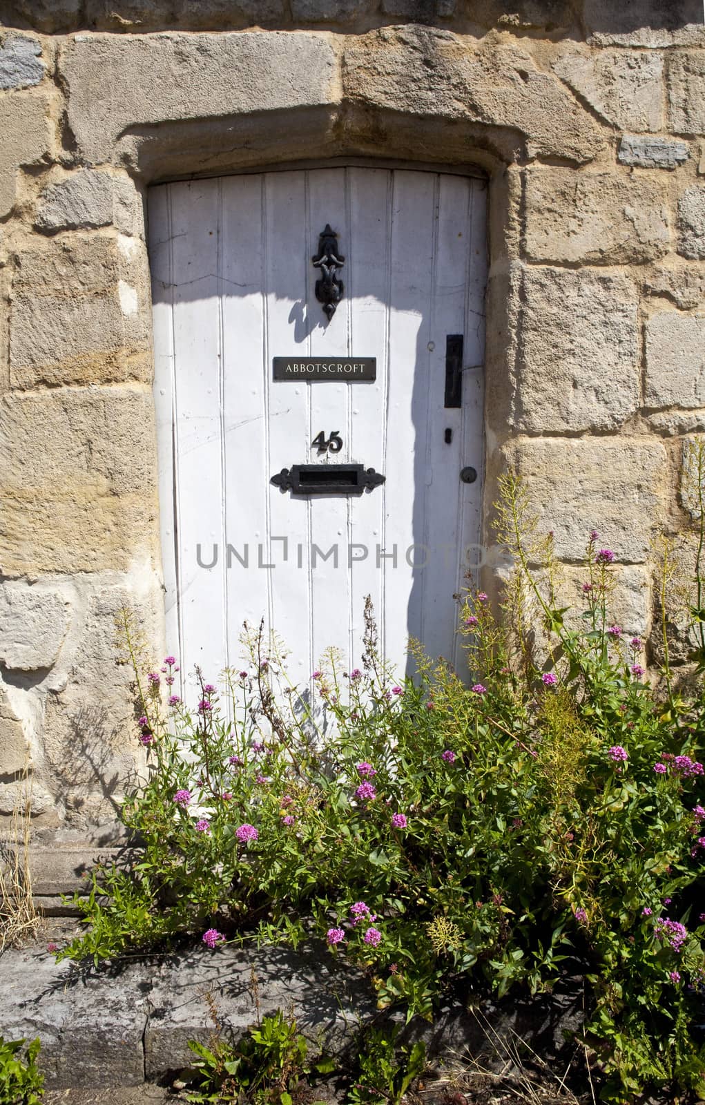 A quaint doorway in a rural British village.