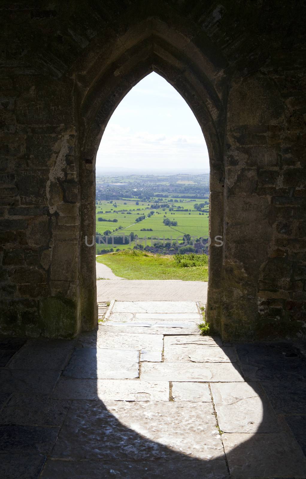 View through the doorway of St. Michaels Tower on Glastonbury Tor in Somerset, England.
