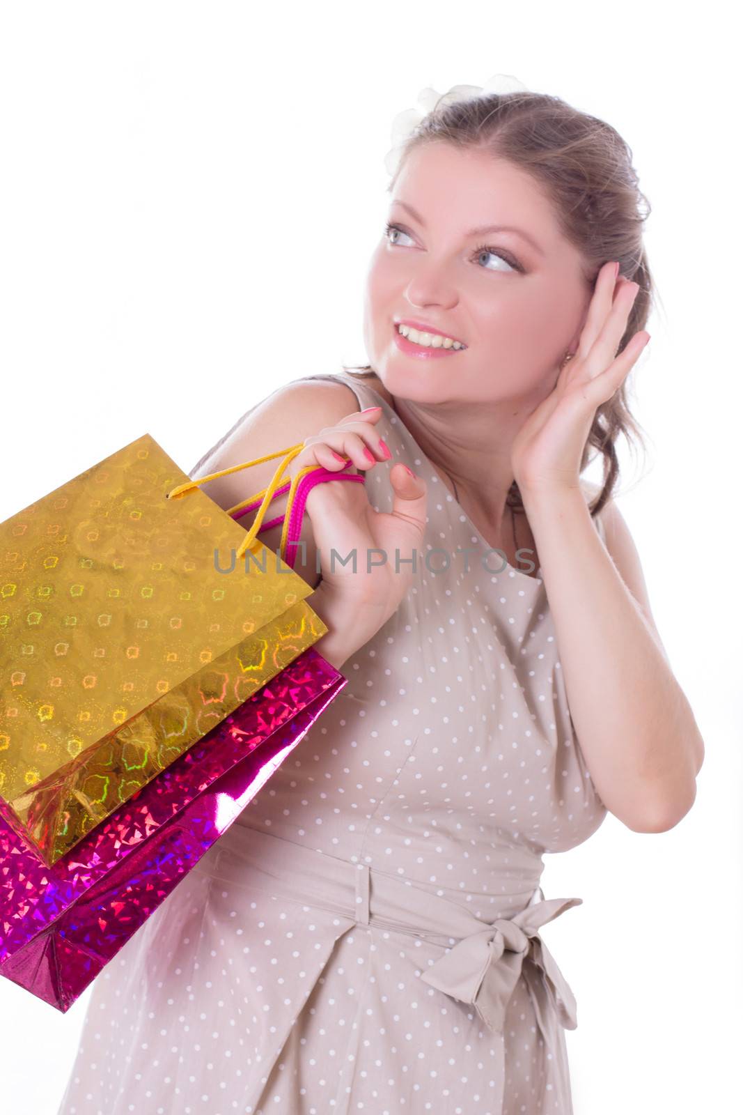 Amazed woman with shopping bags isolated on white, sales concept