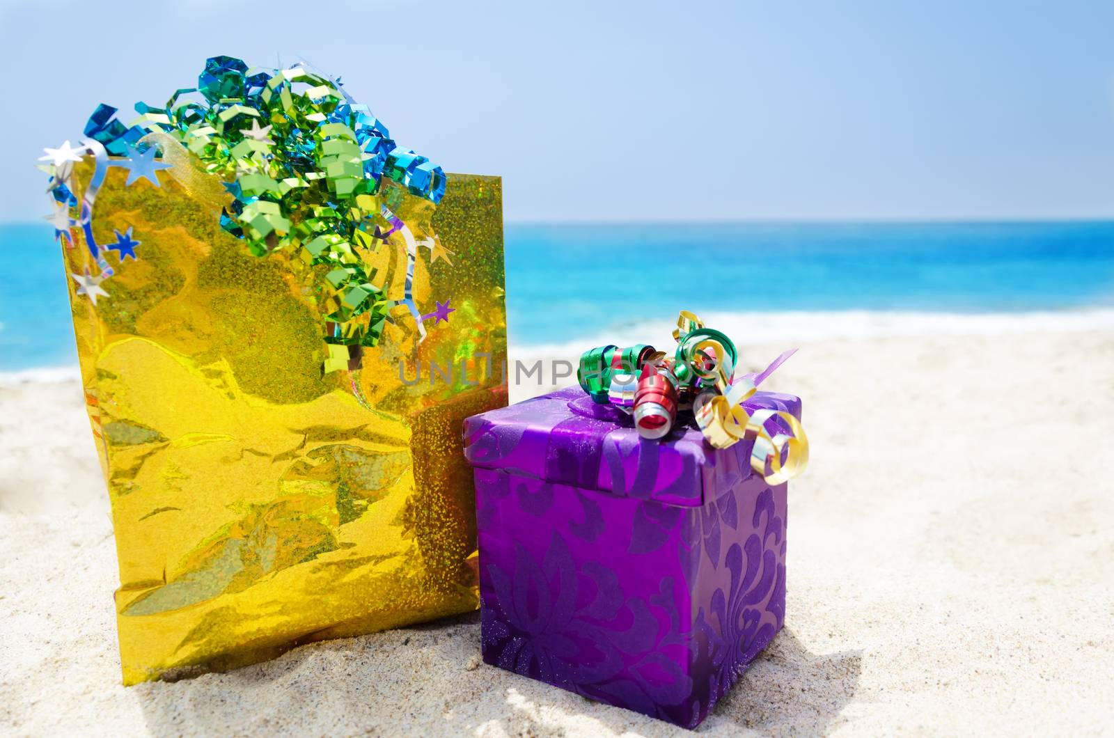 Gift box and gift bag on the beach - holiday concept by EllenSmile