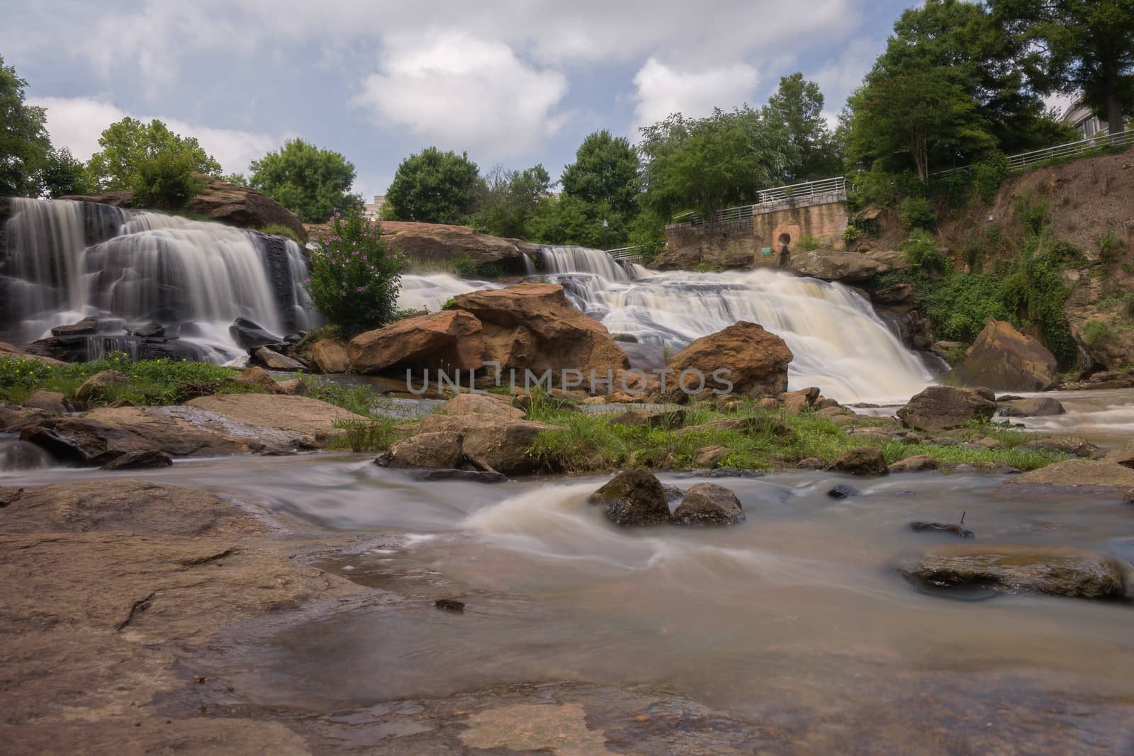 Long exposure captures the slow flowing Reedy River at Falls Park