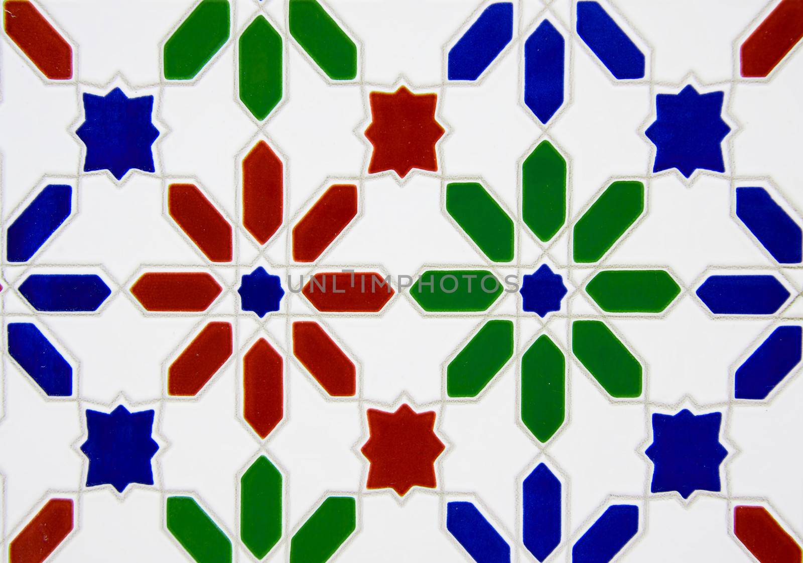 A white tile with traditional spanish pattern