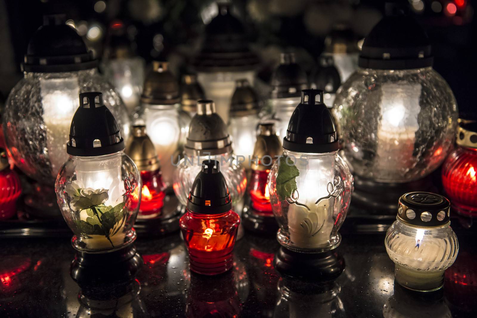 Candles on a grave at night