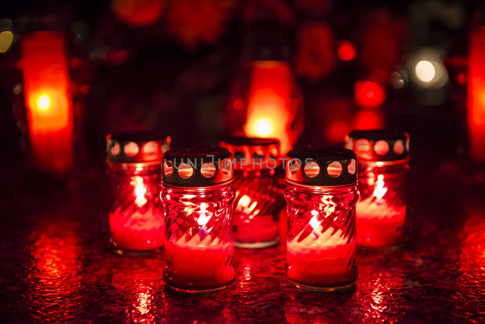 Candles on a grave at night