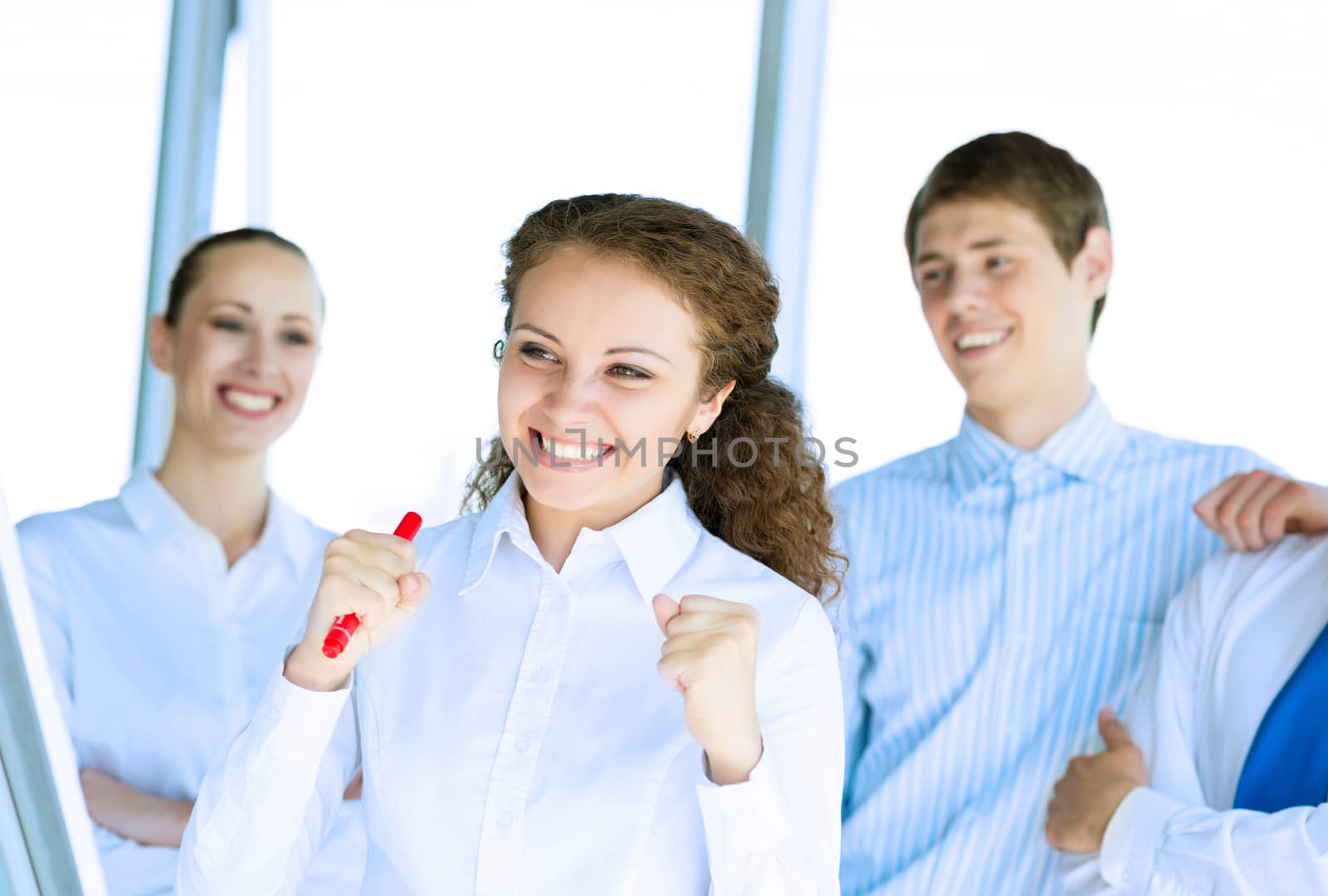 happy business woman standing next to their counterparts outside the flipchart achievements in business