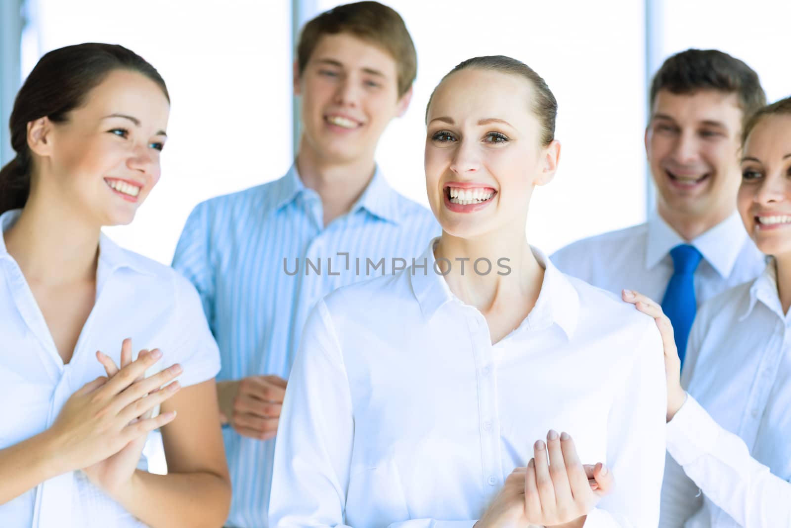 Successful business woman receiving congratulations from his colleagues, business success