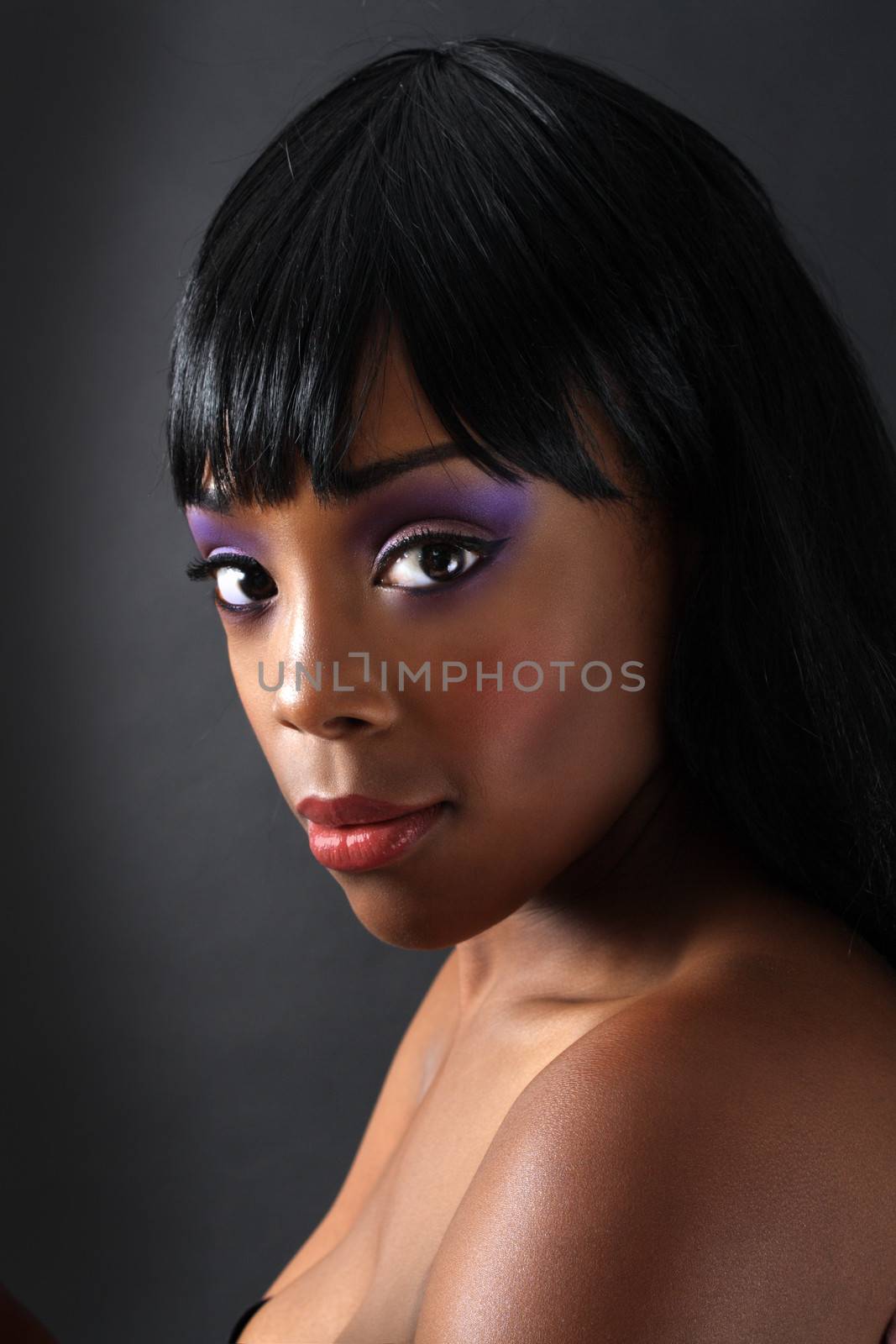 A close-up of an extraordinarily beautiful young black woman with amazingly captivating eyes.