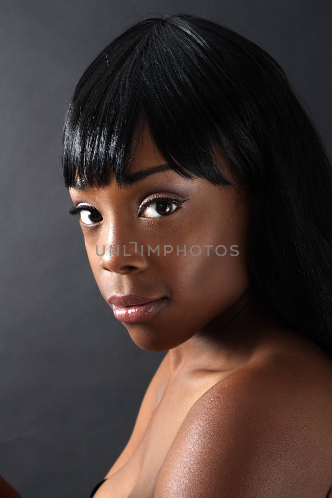 A close-up of an extraordinarily beautiful young black woman with amazingly captivating eyes.