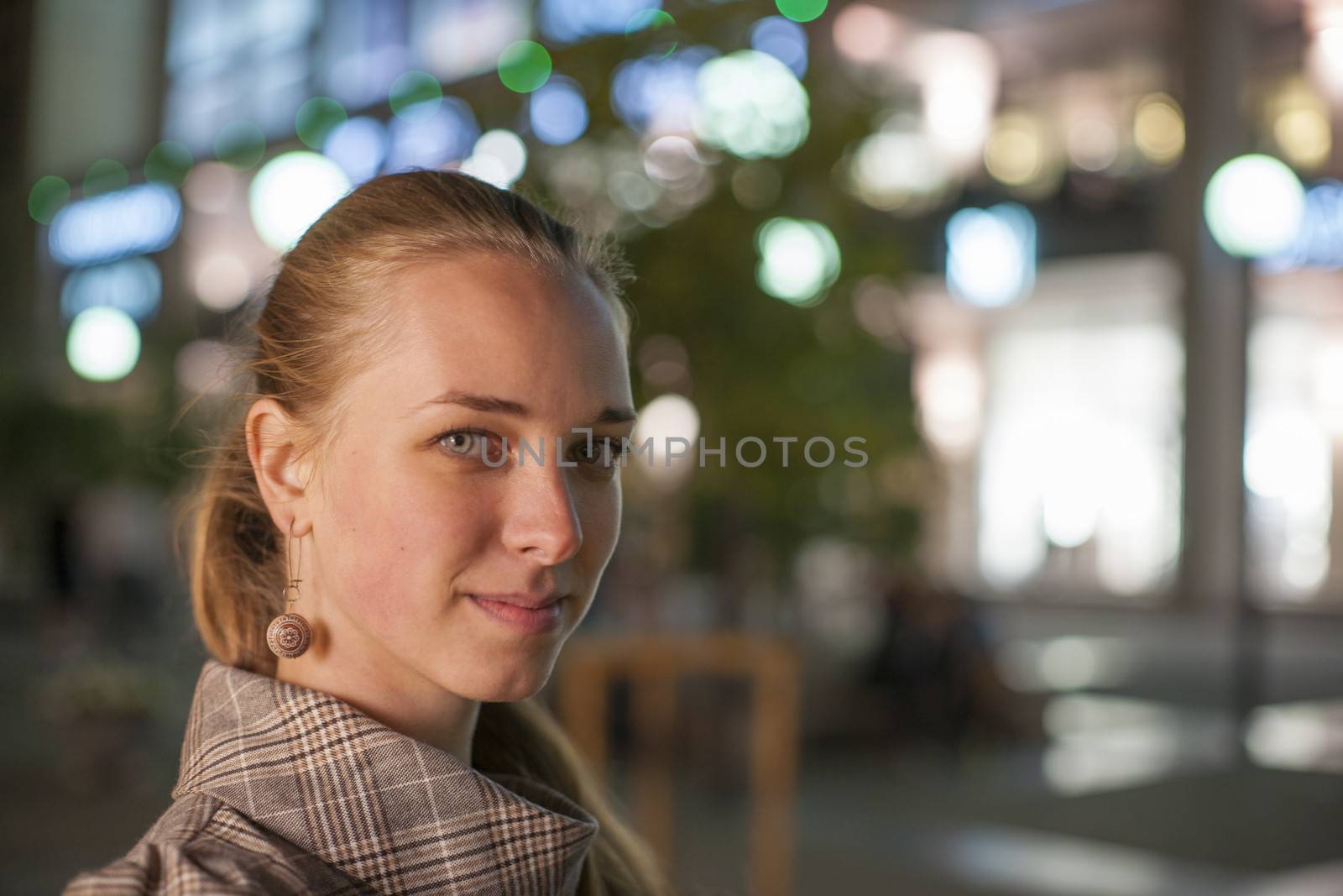 Beautifull girl stay at the square in the night.