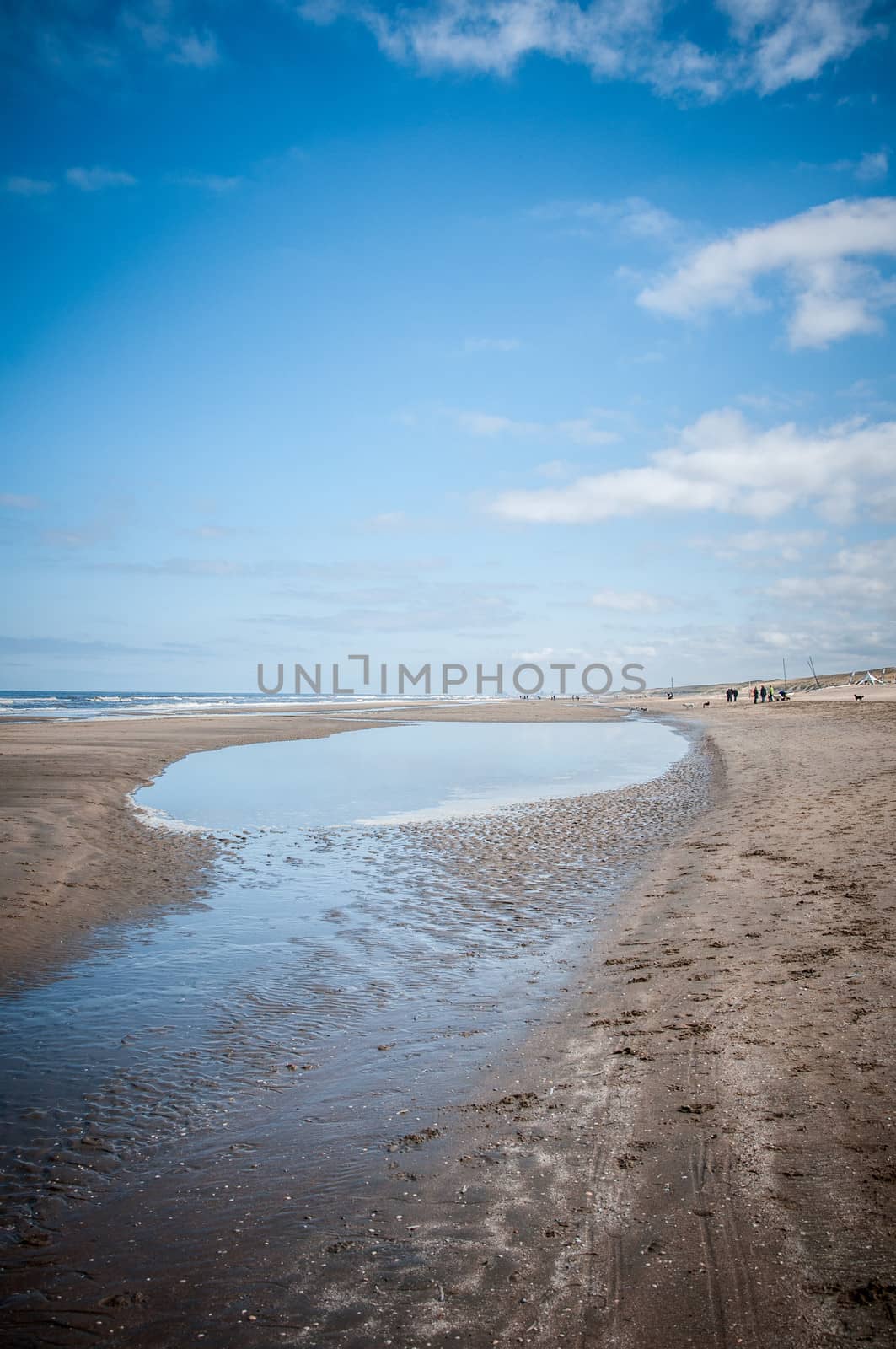 sea and beach with clouds and blue sky