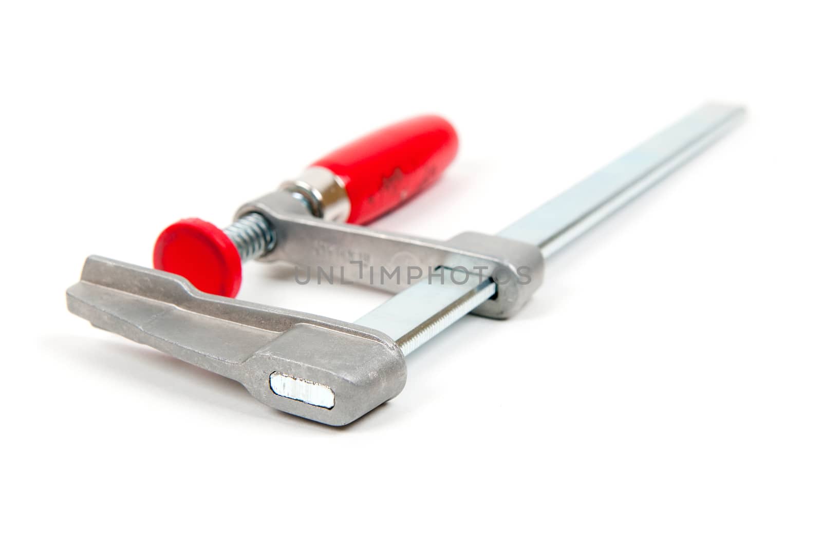 Metal vice with red handle on white background