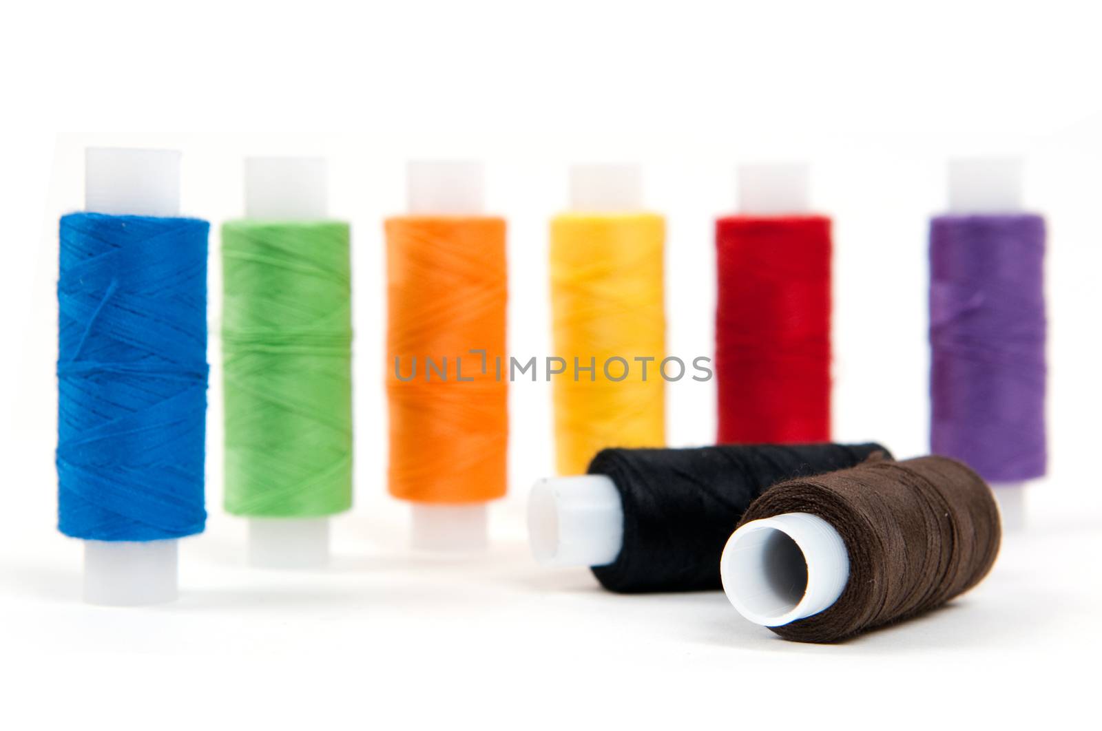 Set of sewing threads on white backgrounds by lexan