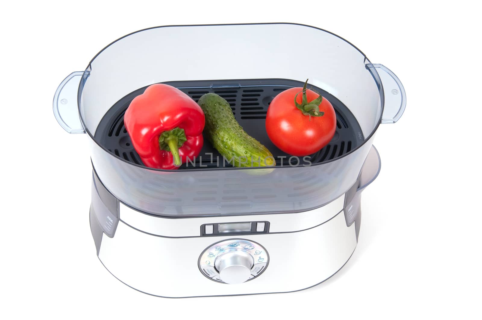 modern electric steamer with fresh vegetables on a white background 