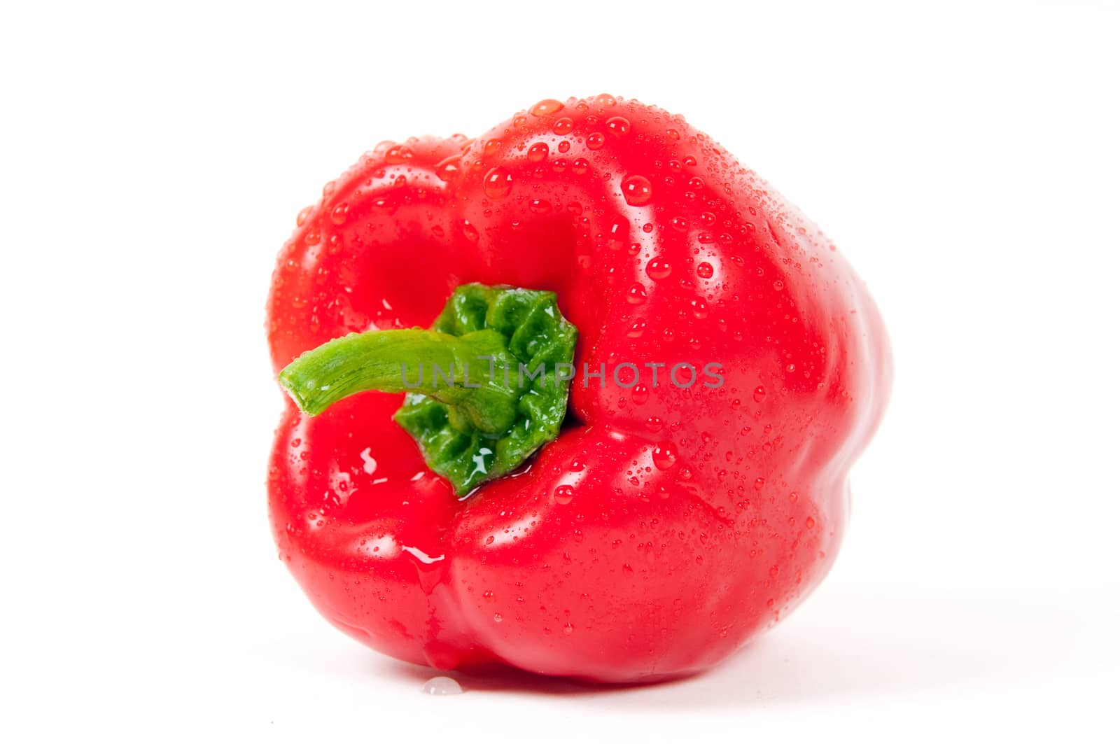 Red pepper with water drops isolated on white background 