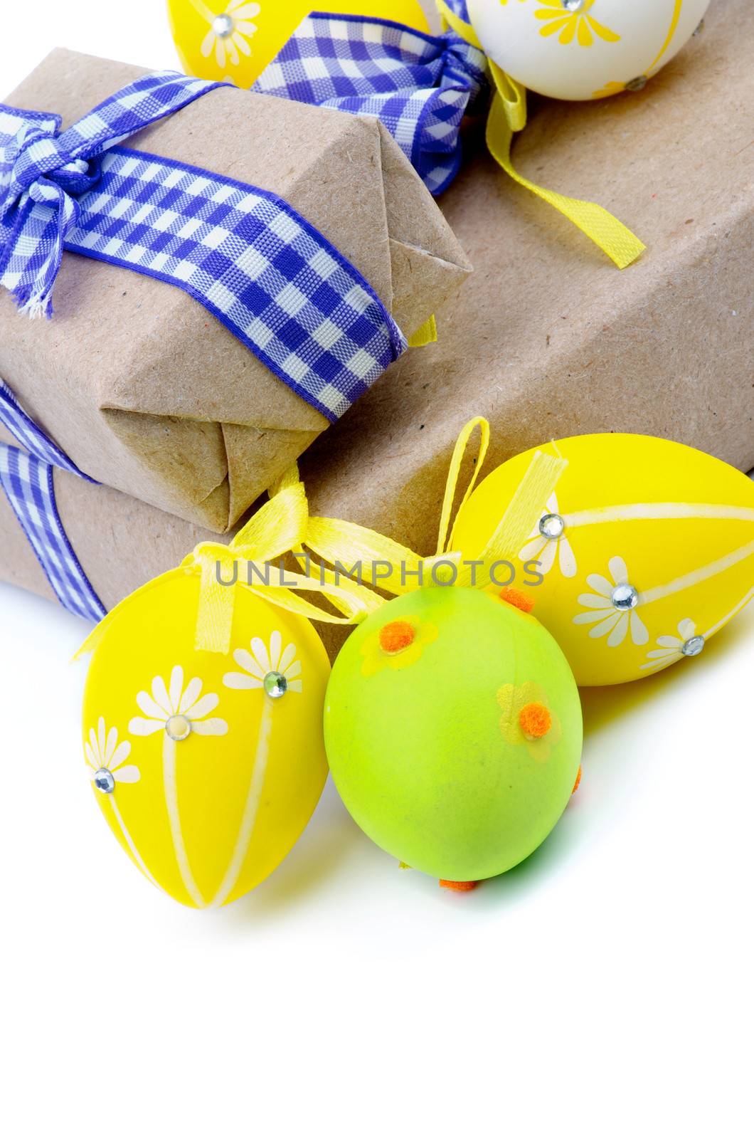 Arrangement of Gift Boxes with Ribbons and Easter Eggs isolated on white background