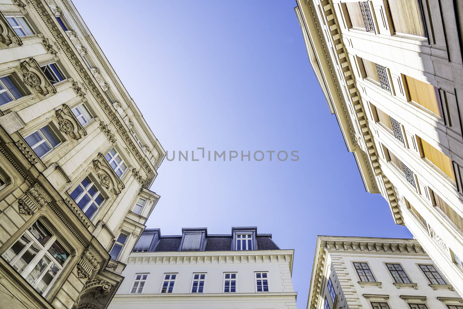 Historic building in Vienna, Austria photographed from below with blue sky for background