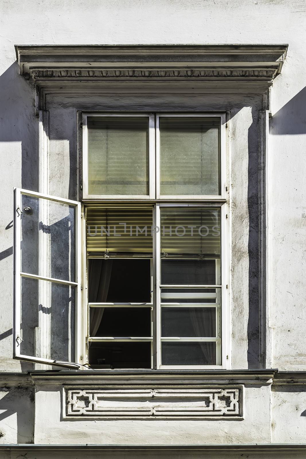 Image of a open window with on a old building