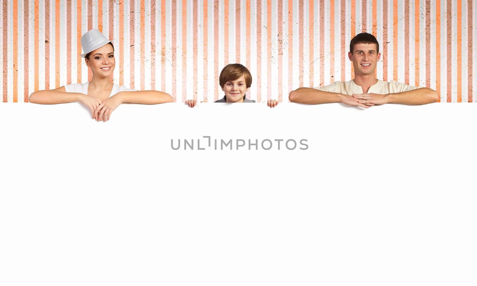 Happy young family with blank banner. Place for text