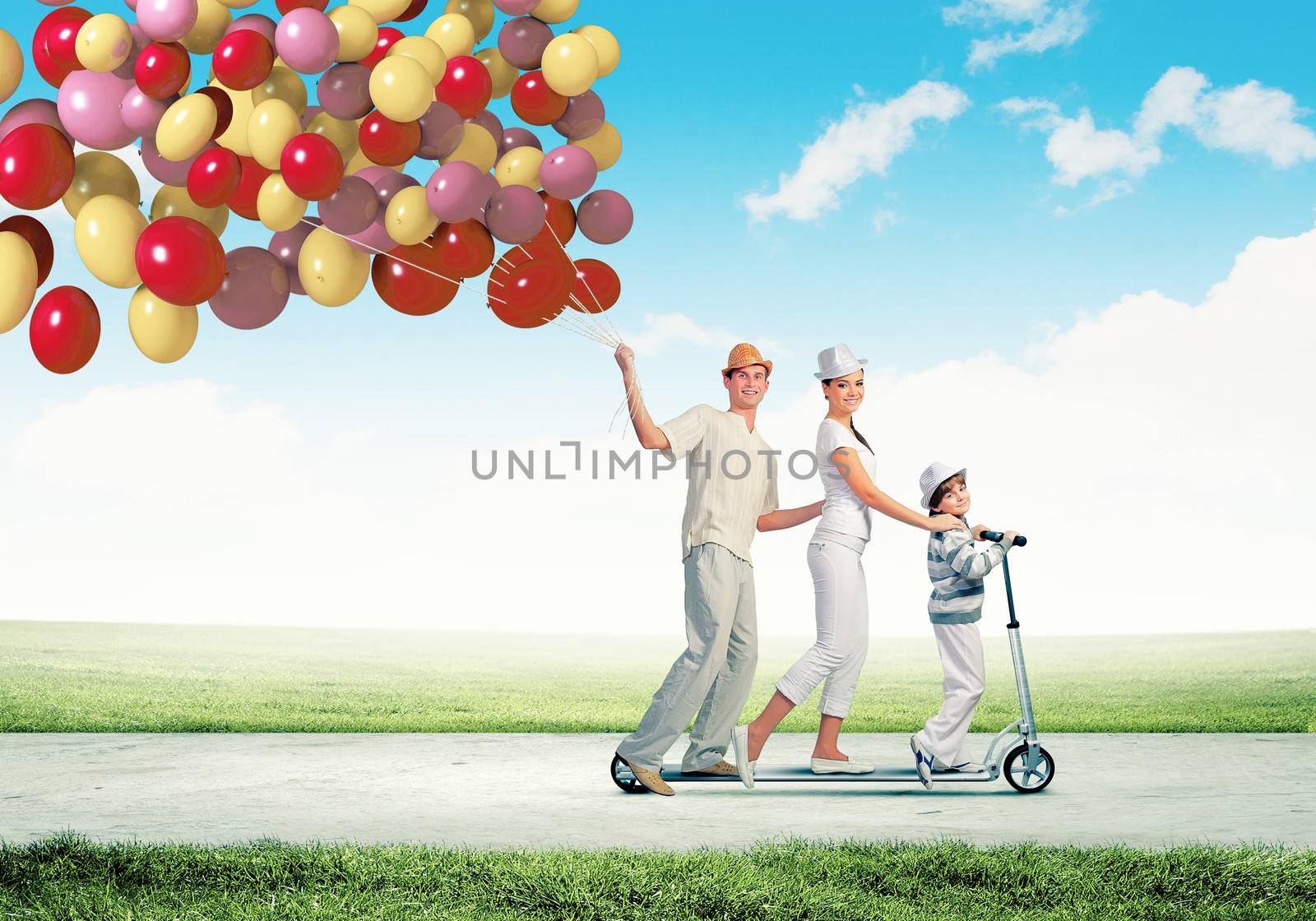 Image of happy young family riding on scooter pulling bunch of colorful balloons