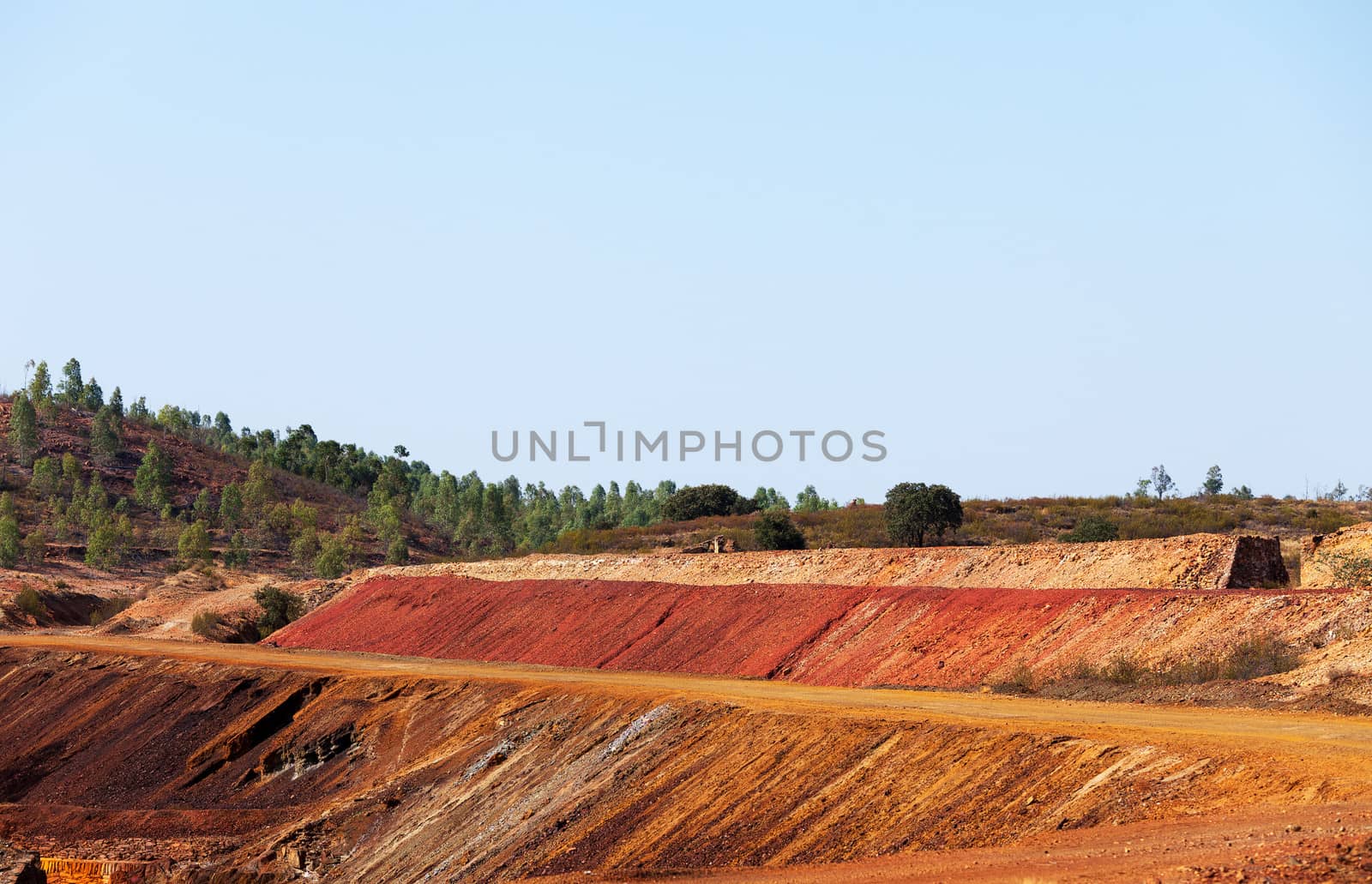 Copper mine tailings or refuse heaps remaining at a mine after the ore has been processed