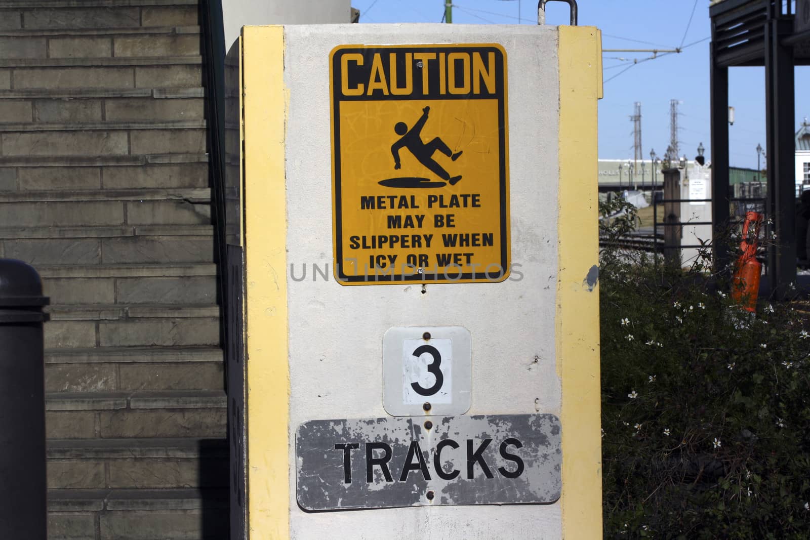Caution sign and tracks sign