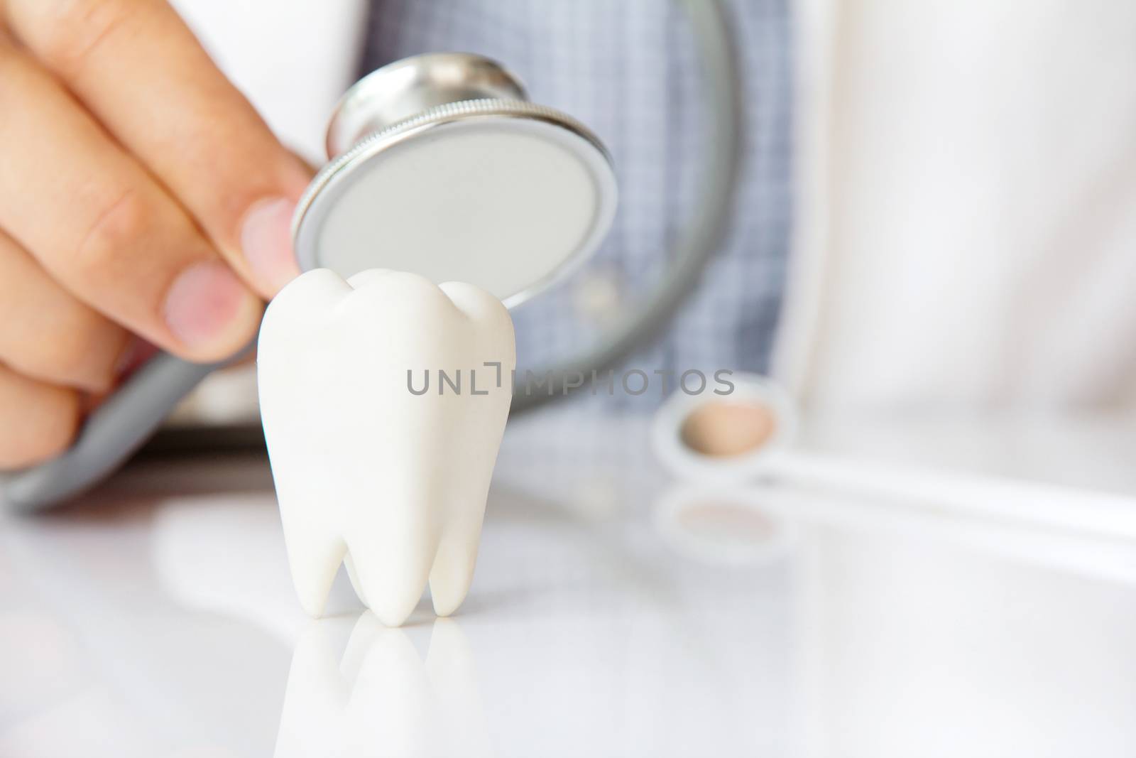 molar with dentist background ,dental concept
