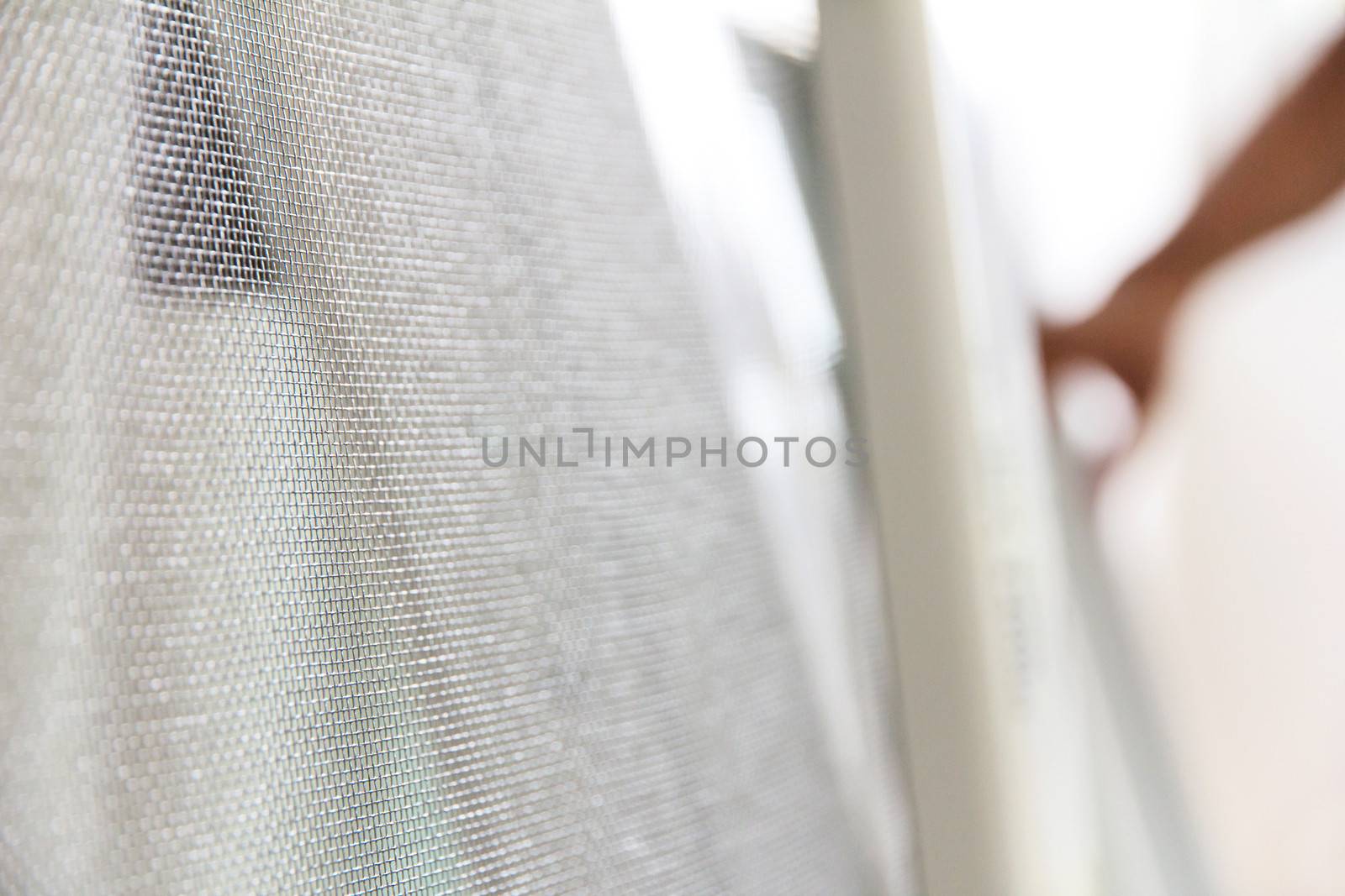 close up of mosquito net and window background