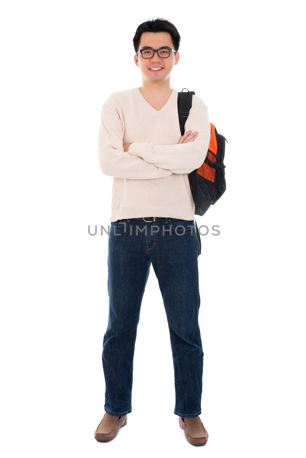 Confident full body Asian adult student in casual wear with school bag standing isolated on white background. Asian male model.