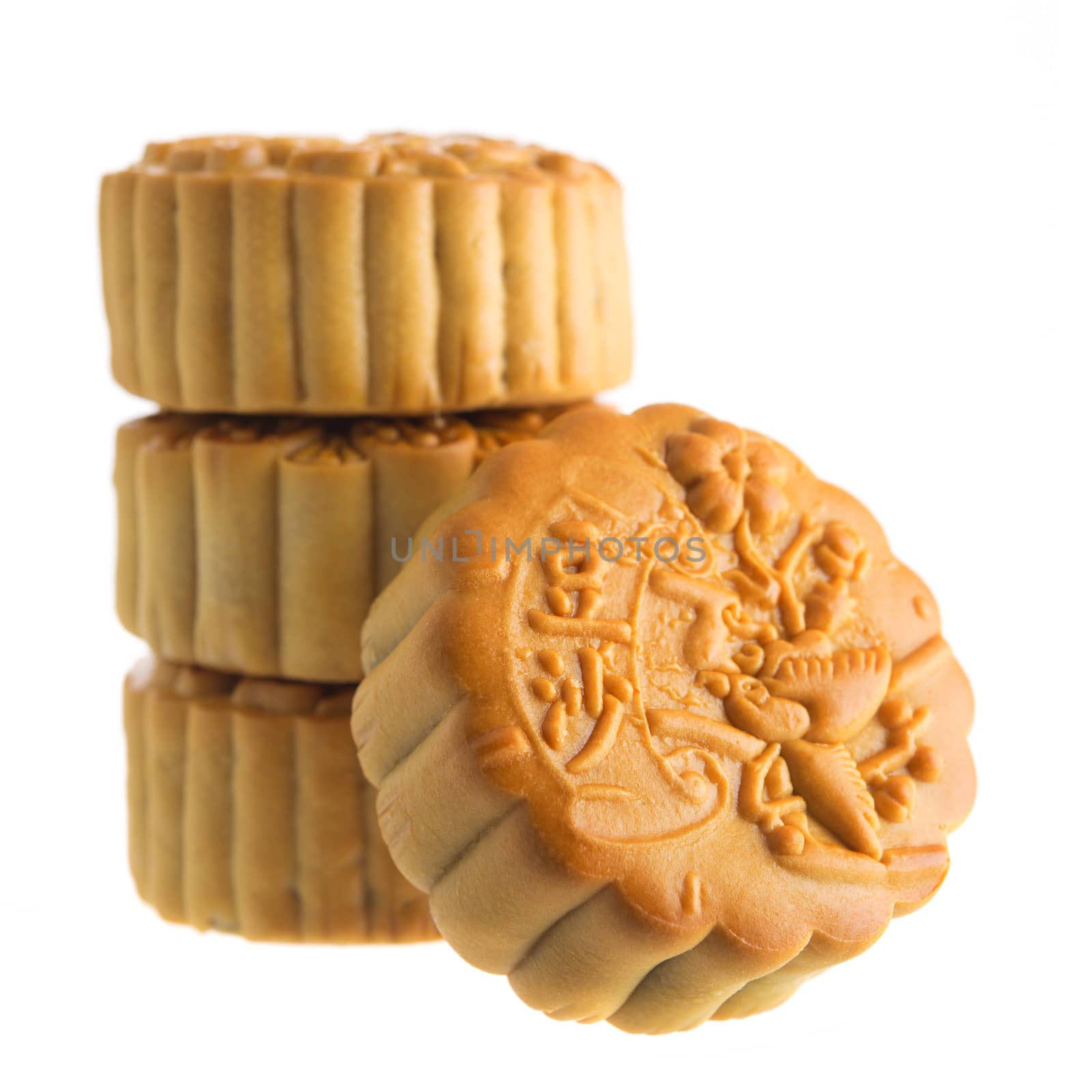 Traditional mooncakes isolated on white background. Chinese mid autumn festival foods. The Chinese words on the mooncakes means red bean paste, not a logo or trademark.