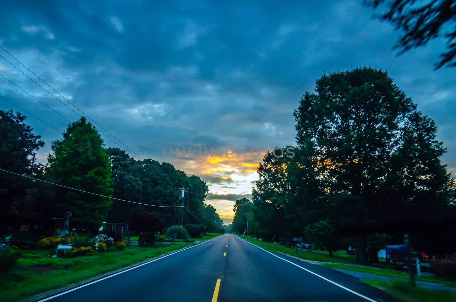beautiful sunrise over road by digidreamgrafix