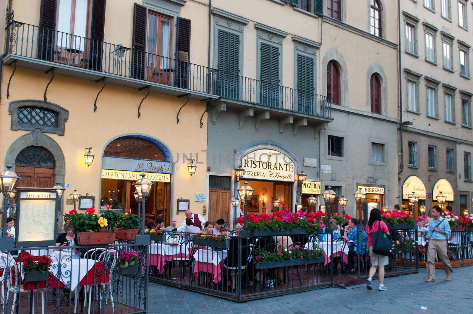 Street restaurants on Piazza della Signoria at evening. Florence, Tuscany, Italy.
