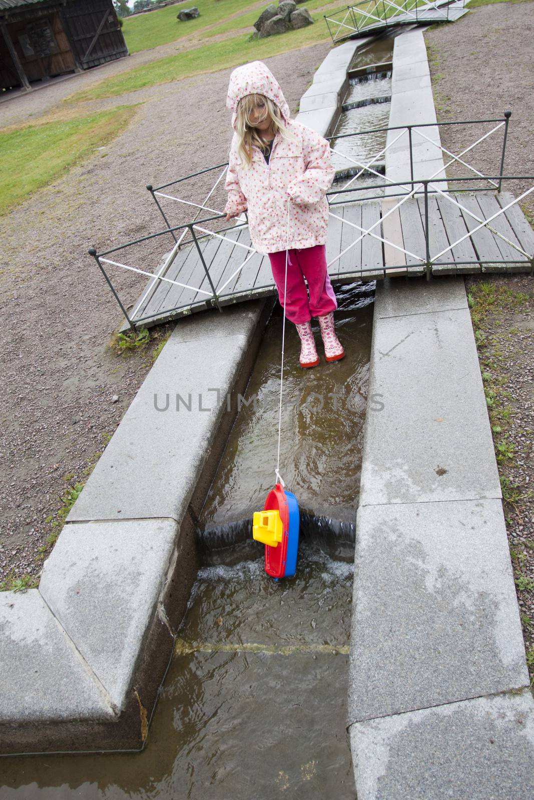A young girl playing at Gota Canal, Sweden, Scandinavia, Europe