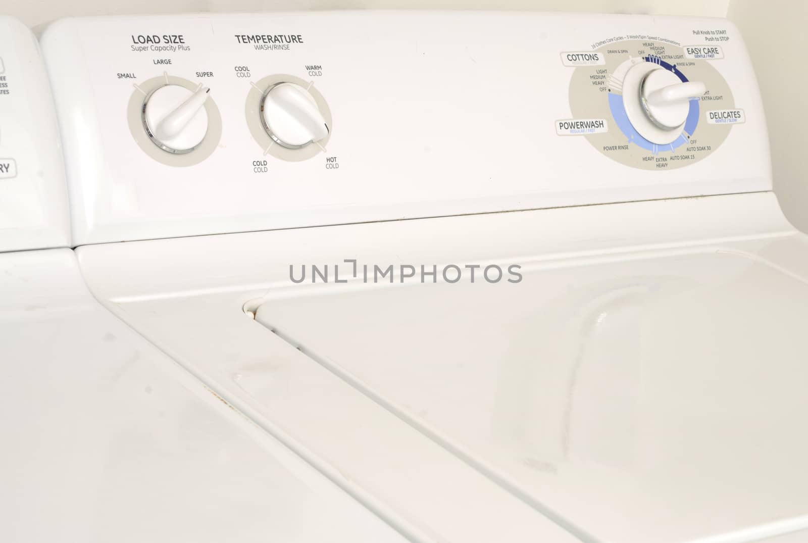 white washing machine or washer and dryer