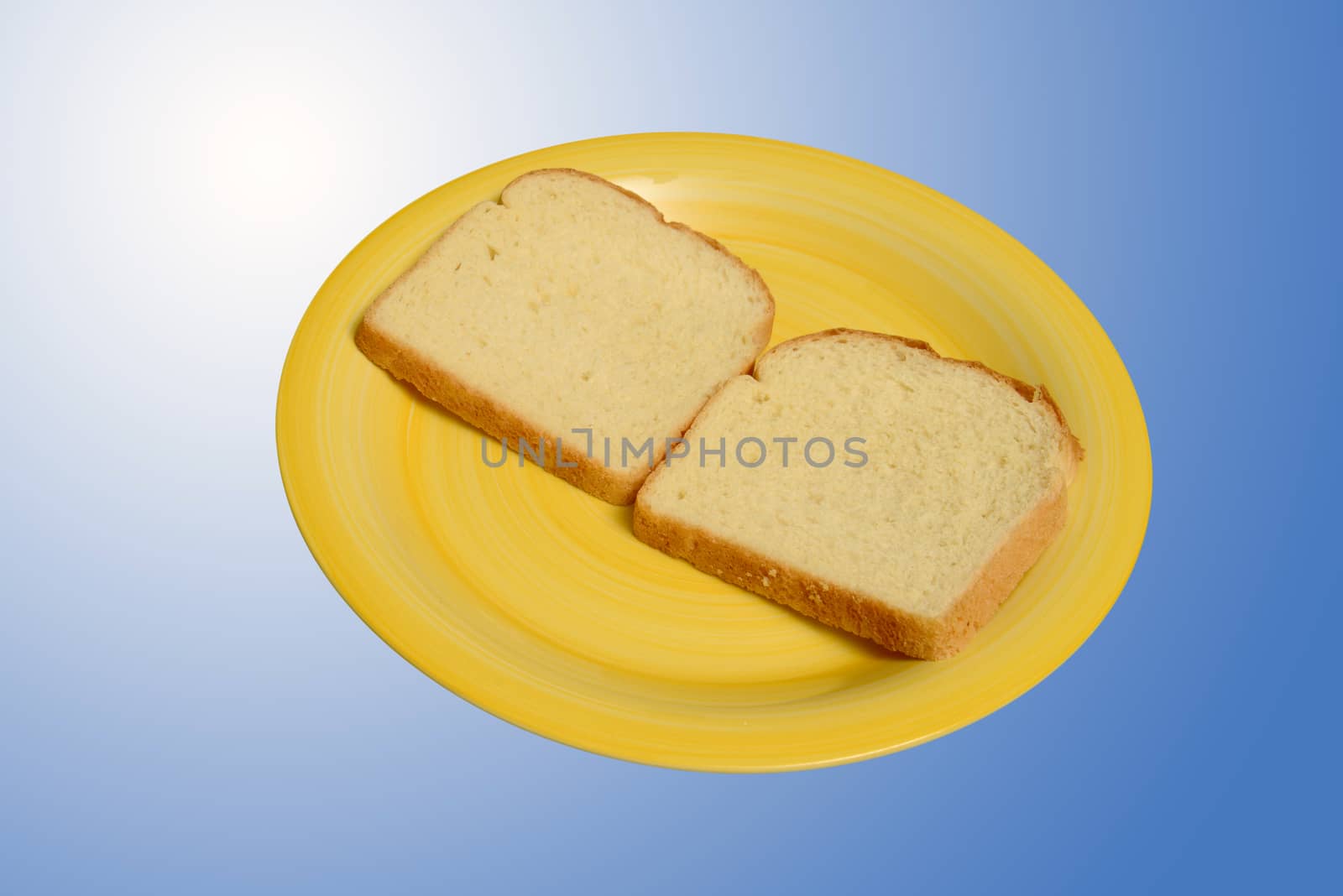 white bread on yellow plate on blue background