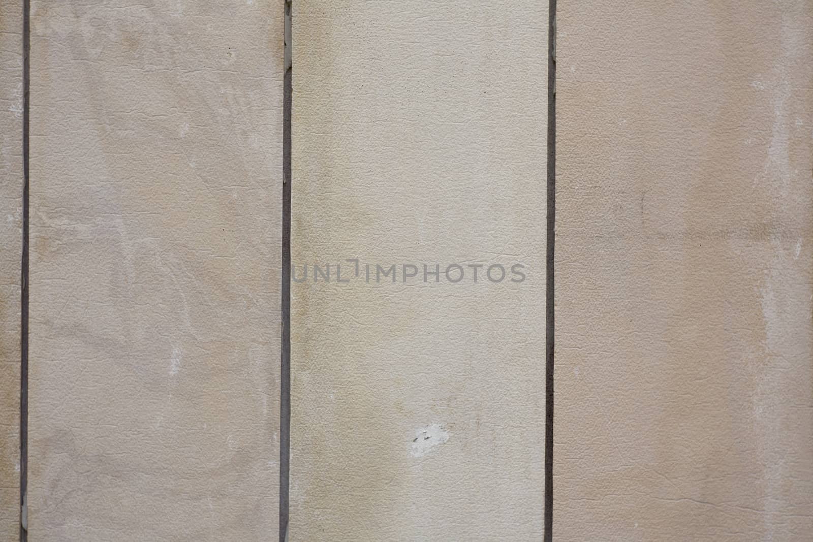 The texture of painted building cement tiles beige, a vertically