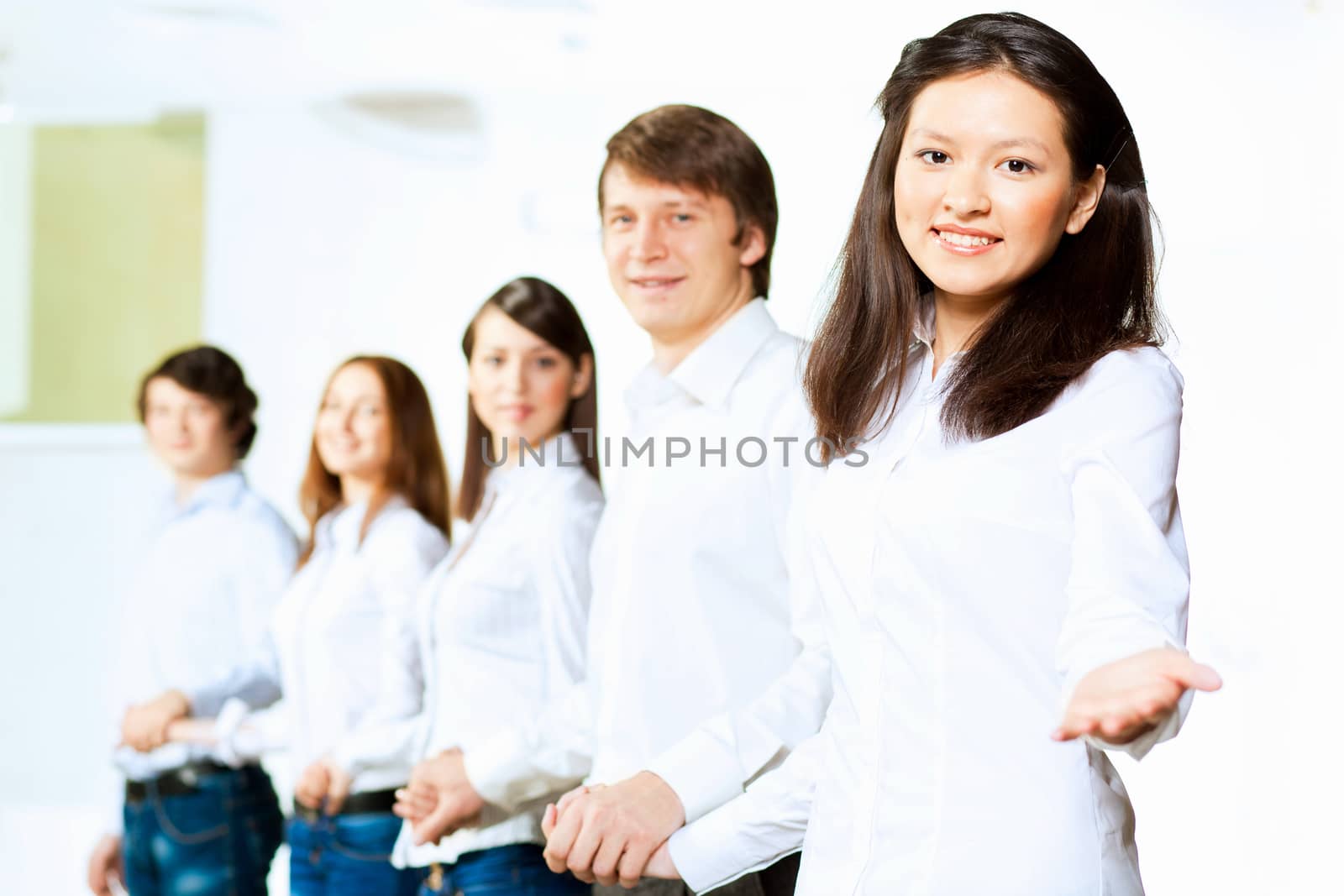 Image of five students in casual wear standing in row