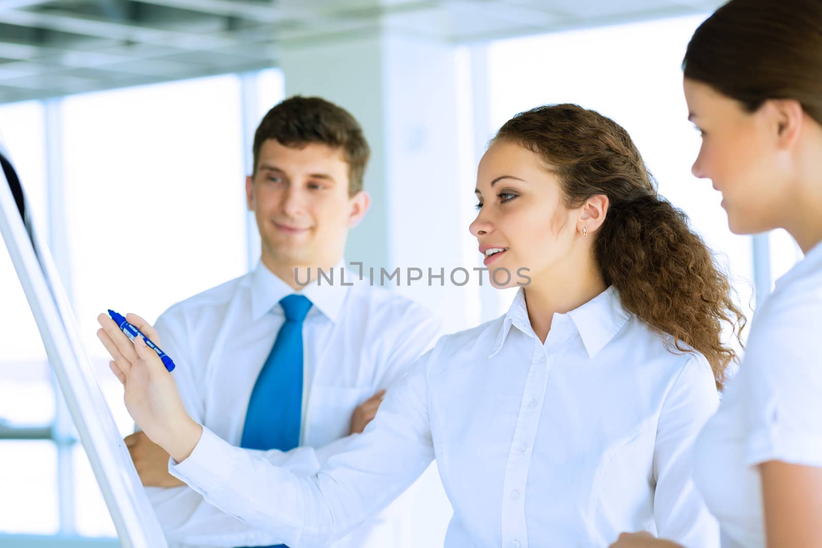 businessmen are meeting near the flipchart by adam121