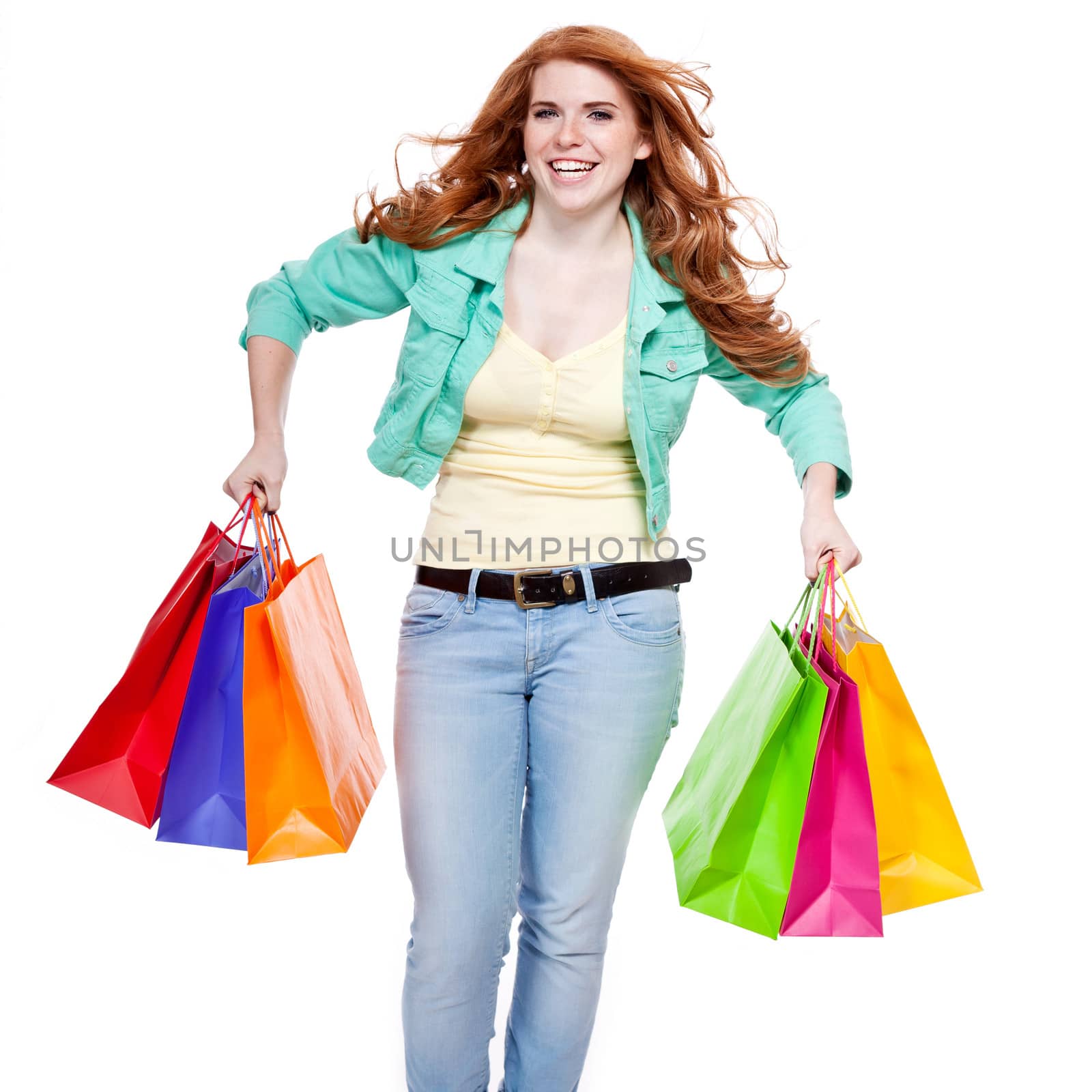 smiling young redhead girl with colorful shoppingbags  by juniart