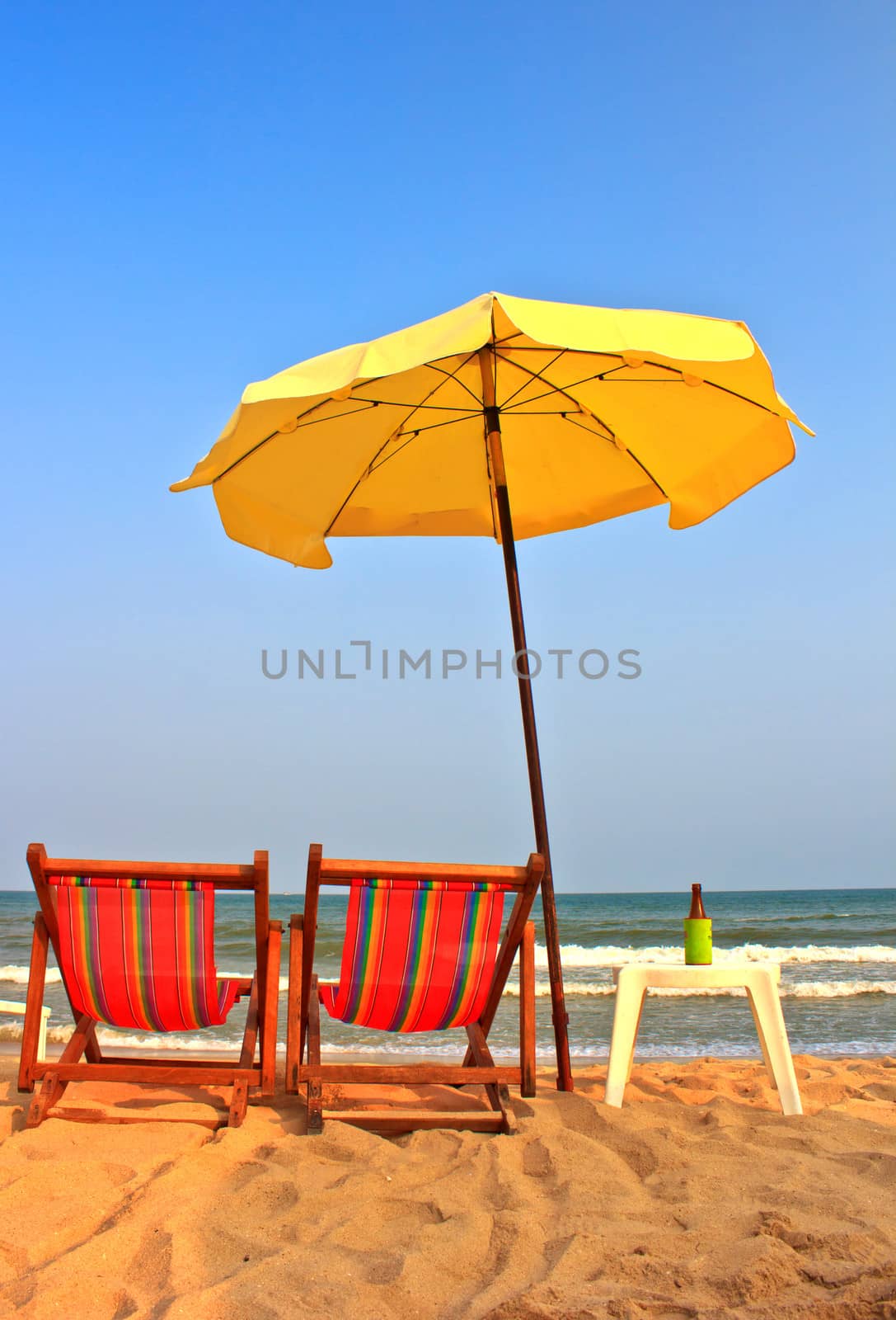 Beach chair and umbrella on tropical beach in Cha-Am ,Thailand