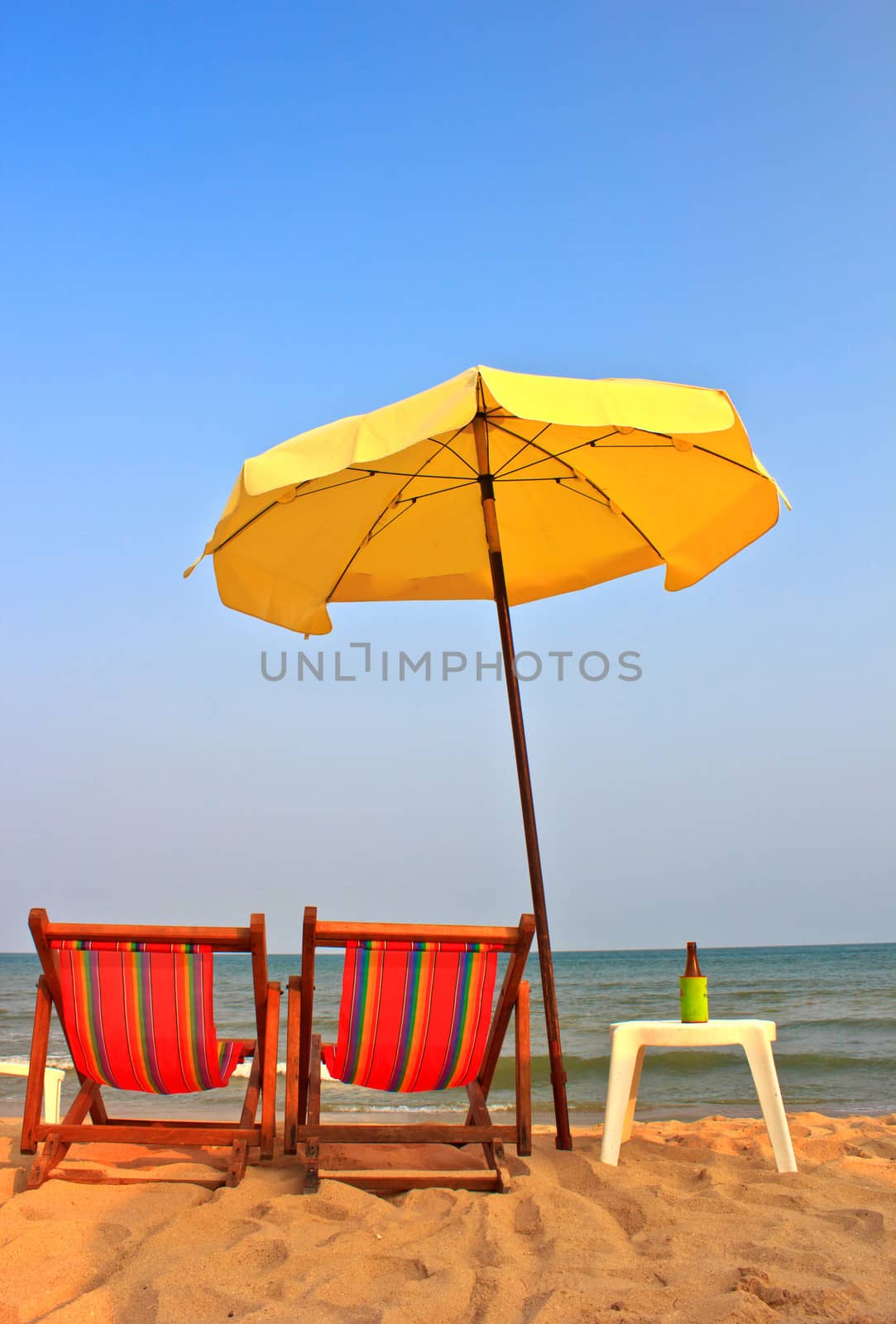 Beach chair and umbrella on tropical beach in Cha-Am ,Thailand