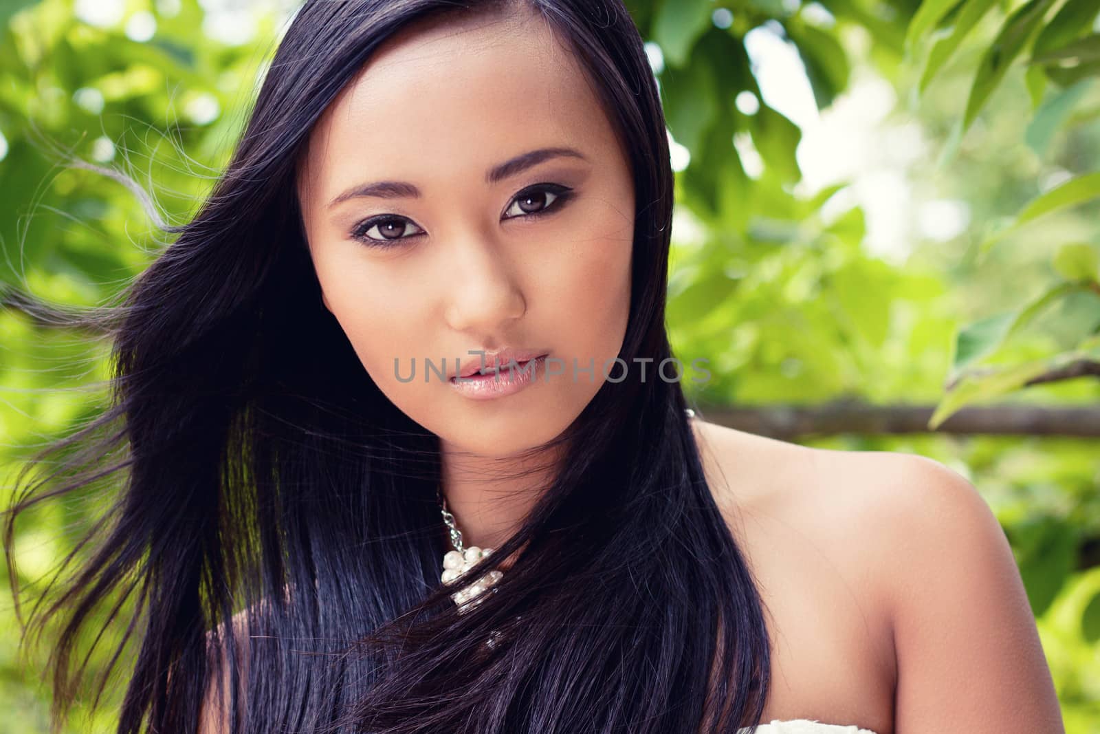 attractive young asian woman beauty portrait outdoor summer green background