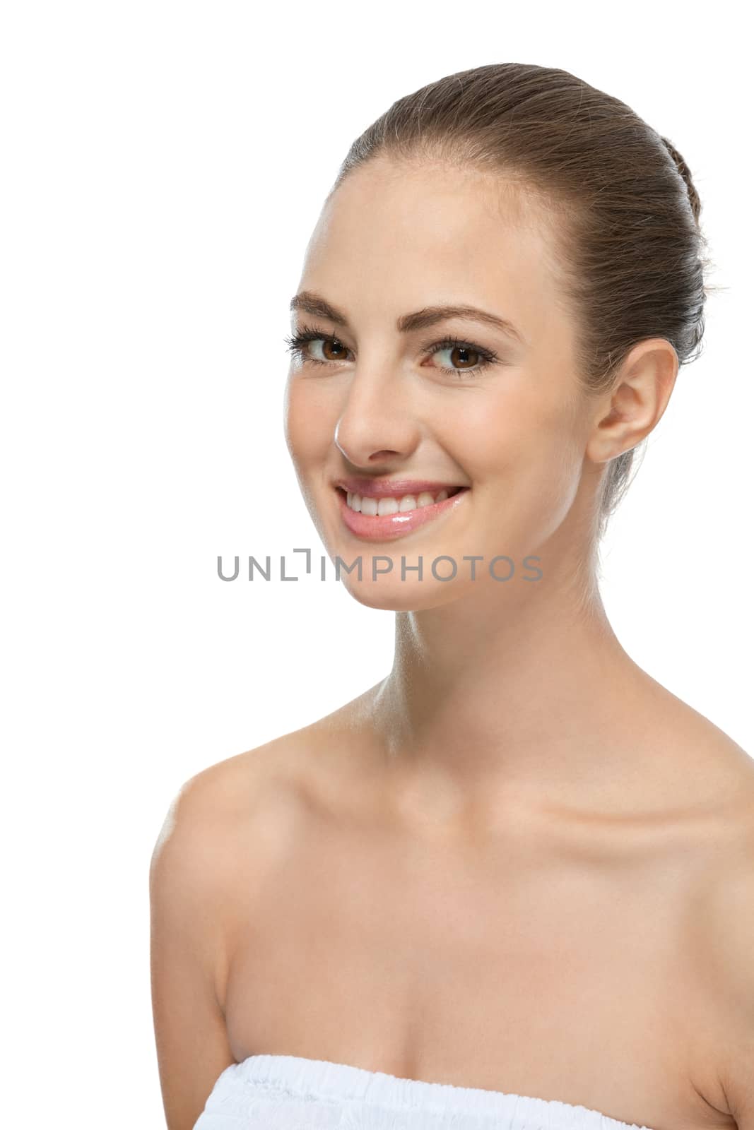 beautiful young woman with perfect skin and soft make up isolated on white
