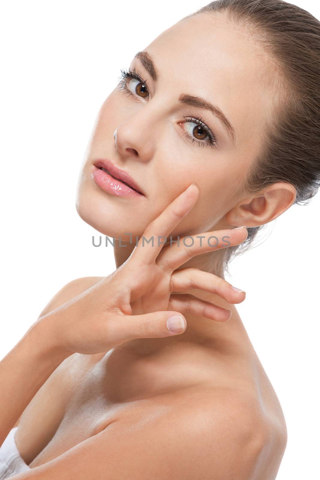 beautiful young woman with perfect skin and soft make up isolated on white