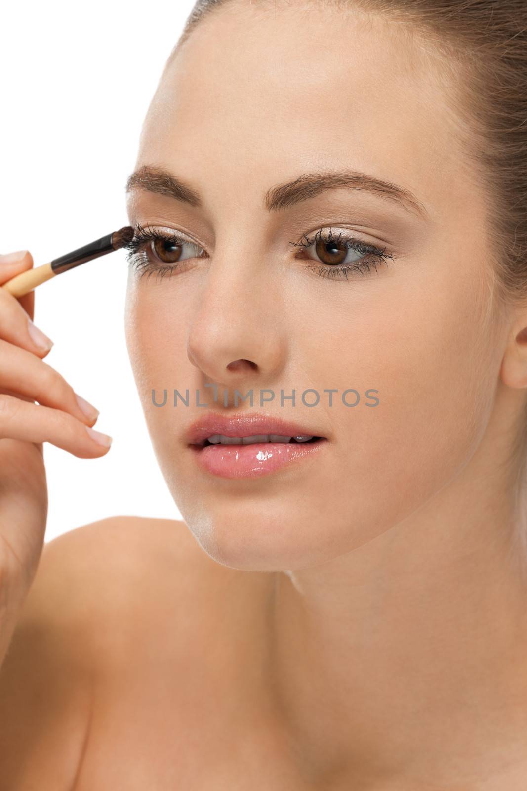 attractive woman in beauty salon make up brown eyeshadow professional 
